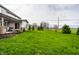 Large backyard with a well-maintained lawn and mature trees, perfect for outdoor activities at 12624 Teaberry Ln, Carmel, IN 46032