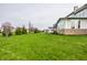 Expansive backyard with lush green lawn and a view of the home's exterior at 12624 Teaberry Ln, Carmel, IN 46032