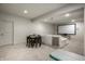 Finished basement featuring a movie screen, a table and chairs, and neutral carpeting at 12624 Teaberry Ln, Carmel, IN 46032