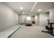 Spacious basement featuring workout equipment, ample room for activities, and neutral carpeting at 12624 Teaberry Ln, Carmel, IN 46032
