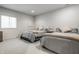 Bright bedroom featuring two cozy beds with soft pillows and neutral-toned linens at 12624 Teaberry Ln, Carmel, IN 46032