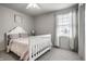 Cozy bedroom with plush carpeting, a ceiling fan and natural light at 12624 Teaberry Ln, Carmel, IN 46032