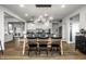 Dining room featuring an elegant light fixture and open access to the kitchen at 12624 Teaberry Ln, Carmel, IN 46032