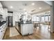 Spacious kitchen with stainless steel appliances, granite countertops, and a dining area at 12624 Teaberry Ln, Carmel, IN 46032