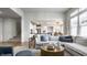 Bright living room showcasing stylish furniture and a clear view of the adjacent kitchen area at 12624 Teaberry Ln, Carmel, IN 46032