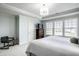 Serene main bedroom with a comfortable bed, soft colors, and plenty of natural light at 12624 Teaberry Ln, Carmel, IN 46032