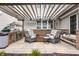 Outdoor patio with stylish seating under a pergola, perfect for relaxing and entertaining at 12624 Teaberry Ln, Carmel, IN 46032
