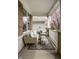 Relaxing covered porch with wicker furniture, rug, and brick siding at 12624 Teaberry Ln, Carmel, IN 46032