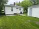 A well maintained backyard with a storage shed and lush, green lawn at 1323 S Ewing St, Indianapolis, IN 46203