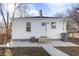 Exterior view of a house with a back door and small back yard at 1323 S Ewing St, Indianapolis, IN 46203