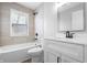 Bathroom with tub, shower, neutral tile, and modern vanity with light countertop at 1323 S Ewing St, Indianapolis, IN 46203