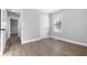 Comfortable bedroom featuring modern flooring and an adjacent doorway at 1323 S Ewing St, Indianapolis, IN 46203