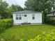 Charming single story home with mature trees and a well maintained lawn at 1323 S Ewing St, Indianapolis, IN 46203