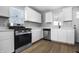 Stylish kitchen featuring stainless steel appliances, crisp cabinetry, and modern countertops at 1323 S Ewing St, Indianapolis, IN 46203