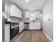 Well-equipped kitchen featuring modern appliances, ample cabinetry and efficient layout at 1323 S Ewing St, Indianapolis, IN 46203