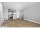 Spacious living room with modern flooring and bright, open layout to the kitchen at 1323 S Ewing St, Indianapolis, IN 46203