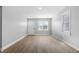 Inviting living room featuring contemporary flooring and a welcoming front door at 1323 S Ewing St, Indianapolis, IN 46203