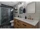 Modern bathroom with a glass-enclosed shower, double vanity, and contemporary fixtures at 14055 Mimosa Ct, Fishers, IN 46038