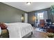 Inviting bedroom with a cozy bed, natural light, and dedicated workspace for comfortable living at 14055 Mimosa Ct, Fishers, IN 46038