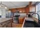 Bright kitchen with stainless steel appliances, granite countertops, and wooden cabinets at 14055 Mimosa Ct, Fishers, IN 46038