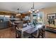 Bright eat-in kitchen leading to the backyard, featuring stainless appliances and wooden cabinetry at 14055 Mimosa Ct, Fishers, IN 46038