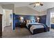 Bright bedroom featuring wainscotting, lamps, and a comfortable king bed at 14055 Mimosa Ct, Fishers, IN 46038