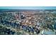 Bird's eye view of a charming neighborhood showcasing a prominent brick church steeple and tree-lined streets at 1434 S Talbott St, Indianapolis, IN 46225