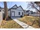 Backyard view with a small deck and path to the garage at 1434 S Talbott St, Indianapolis, IN 46225