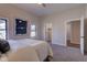 Carpeted bedroom with a closet and an ensuite bathroom at 1434 S Talbott St, Indianapolis, IN 46225