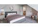 Well decorated bedroom with a bed, carpet floors, a nightstand, and access to the hallway at 1434 S Talbott St, Indianapolis, IN 46225