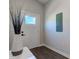 Entryway with white walls, a glass window on door and hardwood flooring at 1434 S Talbott St, Indianapolis, IN 46225