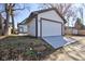 Side angle view of a large two-car detached garage with a concrete ramp leading to the door at 1434 S Talbott St, Indianapolis, IN 46225