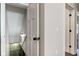 This hallway has white walls and white doors with black hardware at 1434 S Talbott St, Indianapolis, IN 46225