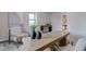 Cozy office with a wooden desk, neutral chairs, artwork, and natural light, perfect for working from home at 1434 S Talbott St, Indianapolis, IN 46225