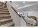 Carpeted staircase leading to the main level with hardwood floors at 1434 S Talbott St, Indianapolis, IN 46225