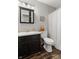 Cozy bathroom with dark vanity, white fixtures, and a shower-tub combination, providing a functional space at 15214 Ten Point Dr, Noblesville, IN 46060