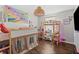 Playful bedroom with colorful decor, hardwood floors, and a cozy bunk bed, perfect for a space at 15214 Ten Point Dr, Noblesville, IN 46060