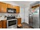 Efficient kitchen with stainless steel appliances, wooden cabinets, and ample counter space for meal preparation at 15214 Ten Point Dr, Noblesville, IN 46060