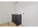 Bathroom vanity with dark cabinets, white countertop, and silver hardware at 1538 Ringgold Ave, Indianapolis, IN 46203