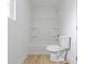 Bright white bathroom featuring a shower-tub combination and white toilet at 1538 Ringgold Ave, Indianapolis, IN 46203