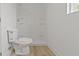 Bathroom with toilet and stand up shower with built in shelves at 1538 Ringgold Ave, Indianapolis, IN 46203