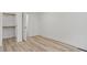 Bedroom with wood-look floors and closet with white trim at 1538 Ringgold Ave, Indianapolis, IN 46203
