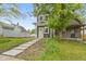 Charming two-story home with a well-manicured lawn and inviting walkway leading to the front door at 1538 Ringgold Ave, Indianapolis, IN 46203
