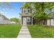 Charming two-story home with a well-manicured lawn and inviting walkway leading to the front door at 1538 Ringgold Ave, Indianapolis, IN 46203