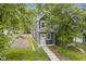 Charming two-story home with a well-manicured lawn and inviting walkway leading to the front door at 1538 Ringgold Ave, Indianapolis, IN 46203