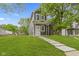 Charming two-story home with a well-manicured lawn and inviting walkway leading to the front door at 1538 Ringgold Ave, Indianapolis, IN 46203
