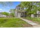 Charming two-story home with a well-manicured lawn and inviting walkway leading to the front door at 1538 Ringgold Ave, Indianapolis, IN 46203