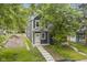 Charming two-story home with a well-manicured lawn and inviting walkway leading to the front door at 1538 Ringgold Ave, Indianapolis, IN 46203