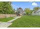 Charming two-story home with a well-manicured lawn and modern gray siding at 1538 Ringgold Ave, Indianapolis, IN 46203