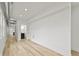 A hallway is freshly painted, has hardwood floors, and bright overhead lighting at 1538 Ringgold Ave, Indianapolis, IN 46203